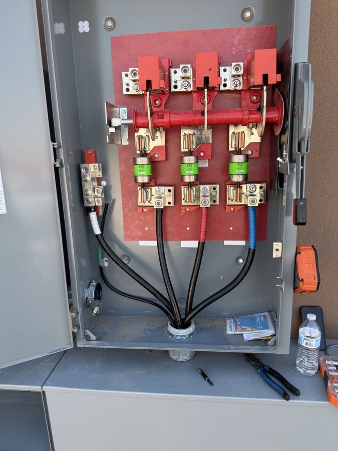 Electrical service gear interior with terminations landed on bus bars