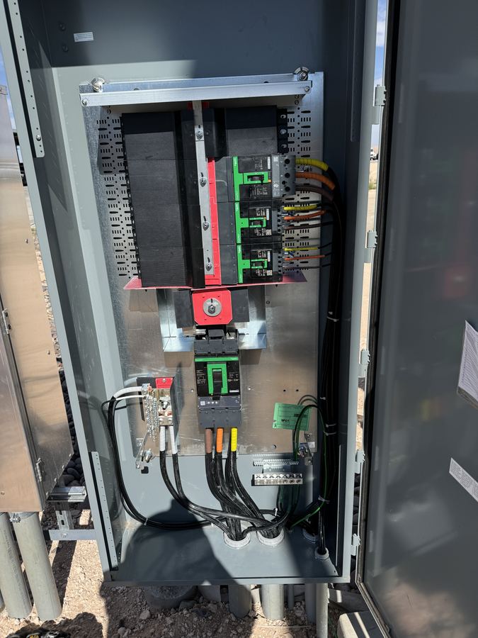 Pad mounted electrical service equipment installed on a job site